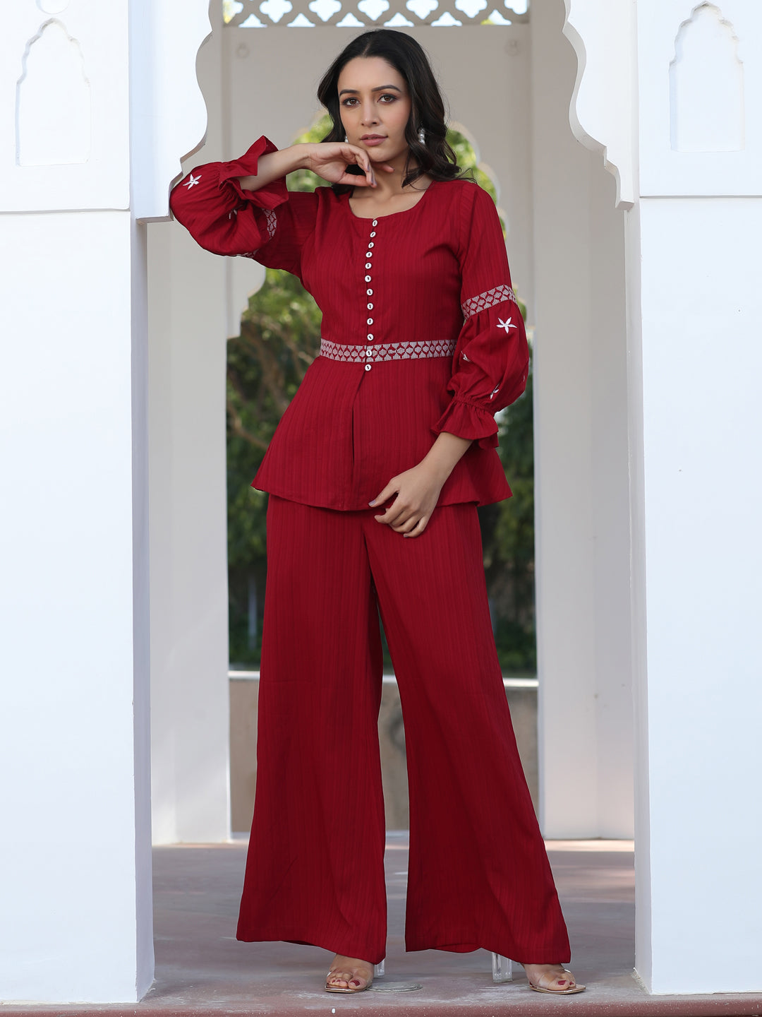 A Red Color Embroidered Lyrca Georgette Textured Co-Ord Set With Peplum Top And Palazzo