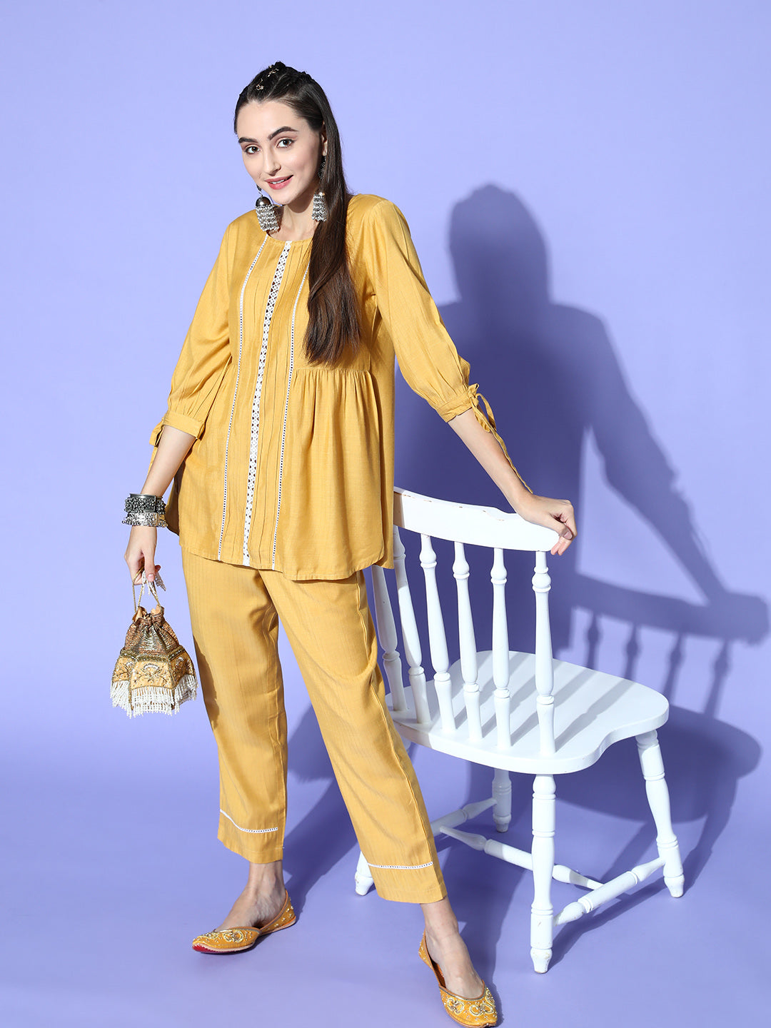 A Mustard Self Weave Rayon Co-Ord Set With A Round Neck Laced Top And A Solid Mustard Self Weave Rayon Pant