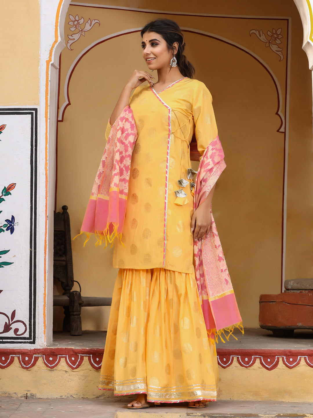 Women yellow gold print angrakha kurta with sharara and dupatta