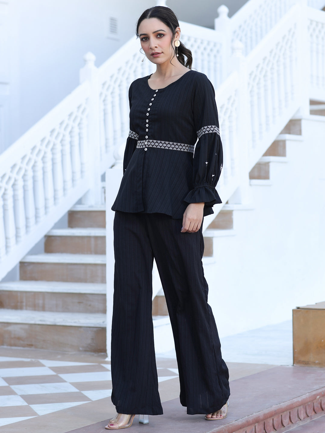A Black Color Embroidered Lyrca Georgette Textured Co-Ord Set With Peplum Top And Palazzo