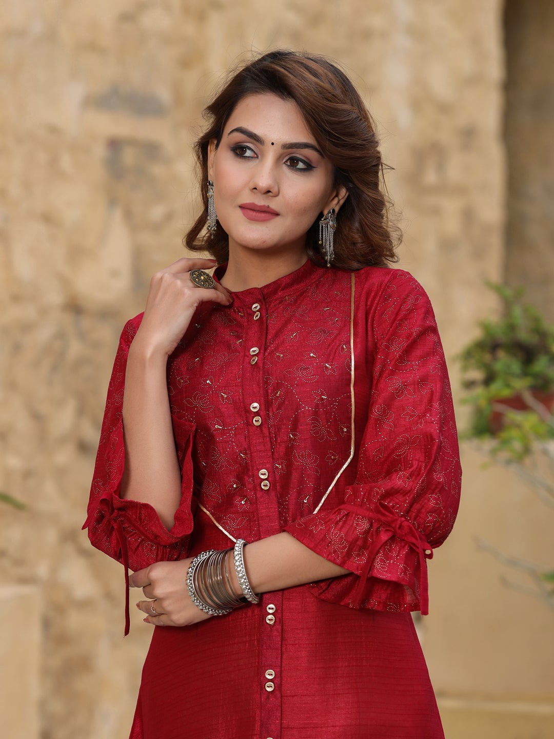 Women Emboidered kurta with buttons embeddeded